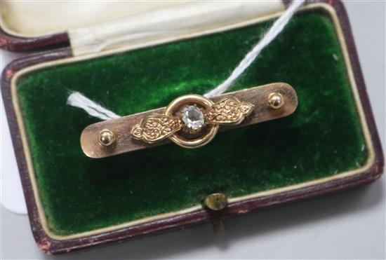 A diamond set bar brooch, 42mm
